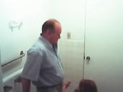 Secretary blows the boss in bathroom