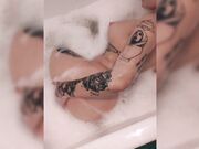 Hot tattooed female partner swallowing dick in bathroom